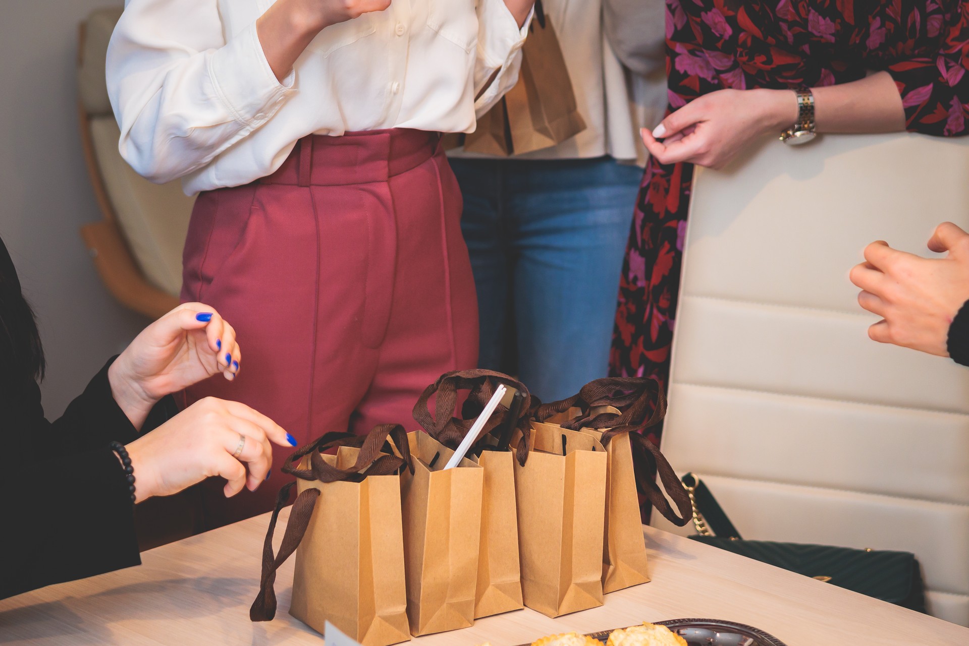 Corporate gifts and souvenirs for employees of the company, gift bag package for conference participants before start, process of presentation of corporate gifts, gift giving at office work